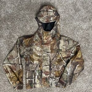 Child camo rain jacket with brimmed hood.